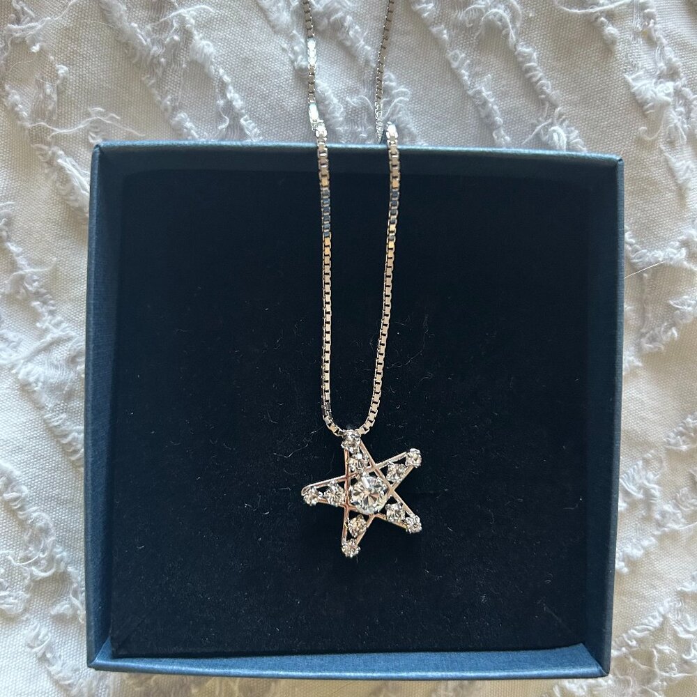 Authentic Swarovski star necklace.